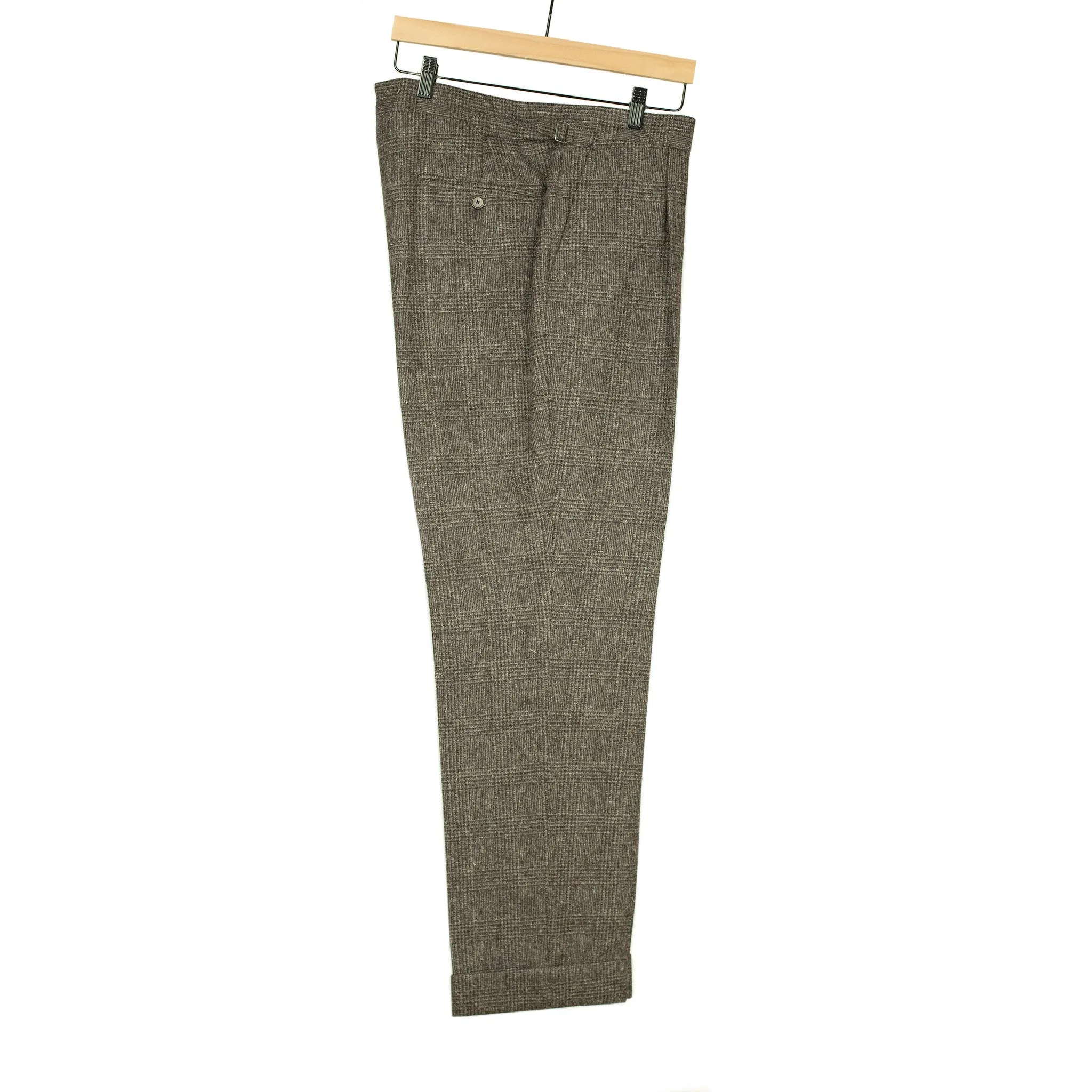 x Sartoria Carrara: Pleated trousers in tonal charcoal Prince-of-Wales undyed wool