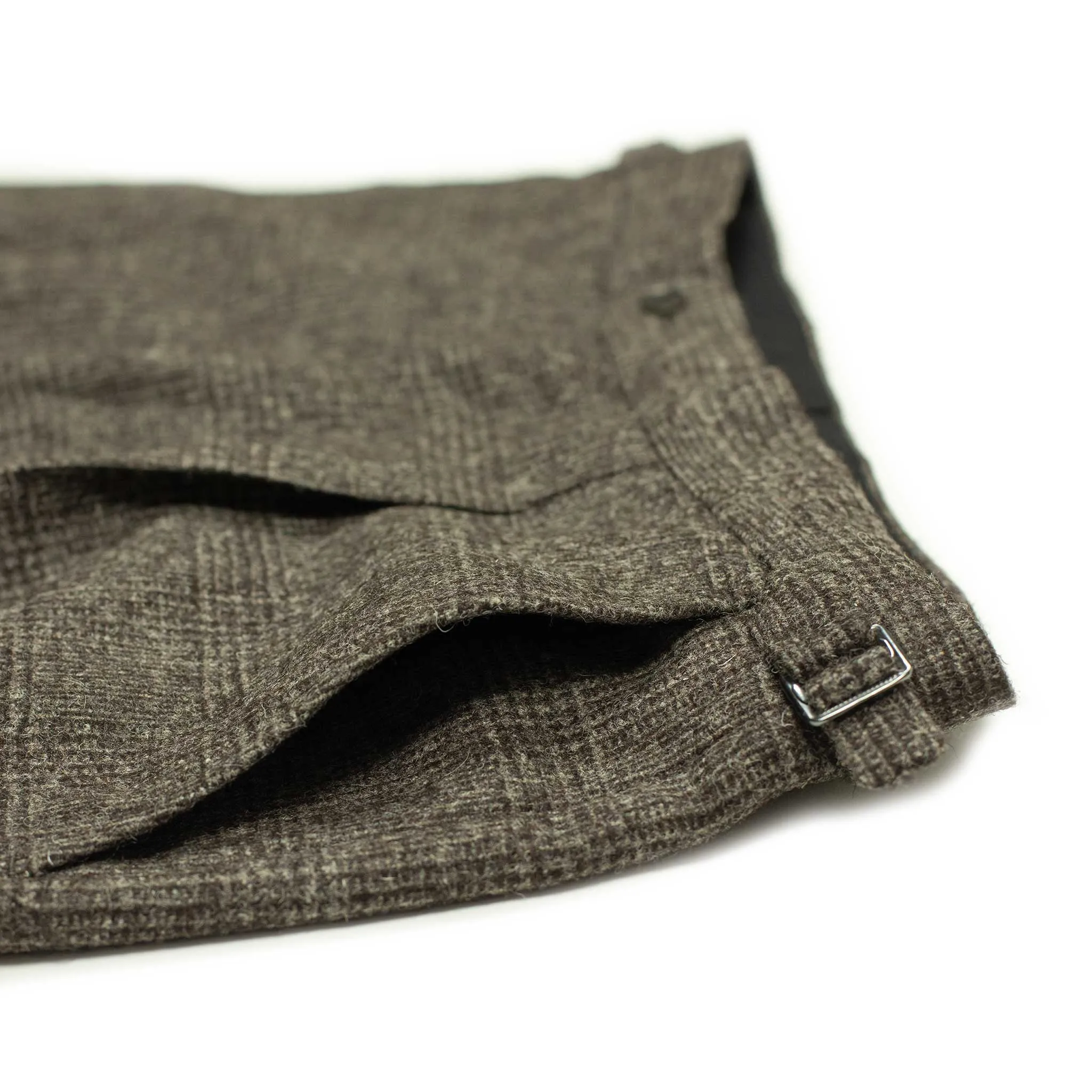 x Sartoria Carrara: Pleated trousers in tonal charcoal Prince-of-Wales undyed wool